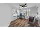 Office features wood-look floors, natural light, and a ceiling fan at 9396 E Purdue Ave # 220, Scottsdale, AZ 85258