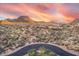 Desert homes situated amid rocky desert, and mountains, sunset enhancing overall appeal at 10671 E Hedgehog Pl, Scottsdale, AZ 85262