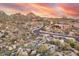 Picture of the elegant desert houses surrounded by scenic mountains and desert under sunset at 10671 E Hedgehog Pl, Scottsdale, AZ 85262