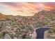Magnificent desert homes nestled in desert environment, with mountains under beautiful sunset at 10671 E Hedgehog Pl, Scottsdale, AZ 85262