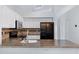Bright kitchen with granite counters, tile backsplash, white cabinets, and stainless steel appliances at 1120 N Val Vista Dr # 2, Gilbert, AZ 85234