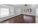 Bright living room featuring wood floors, a ceiling fan, and a bay window that offers views and natural light at 1120 N Val Vista Dr # 2, Gilbert, AZ 85234