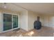 Covered patio featuring tile floors, sliding glass doors, and a grill at 1120 N Val Vista Dr # 2, Gilbert, AZ 85234