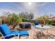Backyard features a hot tub, outdoor seating, and mature landscaping at 11381 E Poinsettia Dr, Scottsdale, AZ 85259