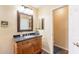Bathroom with a modern vanity, framed mirror, and a separate toilet area at 11381 E Poinsettia Dr, Scottsdale, AZ 85259