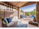 Spacious covered patio with inviting seating, barbecue, and outdoor dining area at 11381 E Poinsettia Dr, Scottsdale, AZ 85259