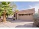 Charming single-story home featuring desert landscaping, a two-car garage, and neutral tones at 11381 E Poinsettia Dr, Scottsdale, AZ 85259