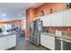 Open kitchen showcases stainless steel appliances, granite countertops, and an adjacent dining area and living room at 11381 E Poinsettia Dr, Scottsdale, AZ 85259