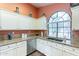 Beautiful kitchen features stainless steel appliances, granite countertops, and a view to the outside at 11381 E Poinsettia Dr, Scottsdale, AZ 85259