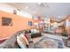 Open-concept living area with vaulted ceilings, colorful walls, and natural light at 11381 E Poinsettia Dr, Scottsdale, AZ 85259