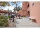 Outdoor common area with built-in grills, seating, and covered parking at 12212 N Paradise Village Pkwy # 308, Phoenix, AZ 85032