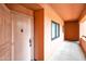 Hallway with unit door and small window at 12212 N Paradise Village Pkwy # 308, Phoenix, AZ 85032