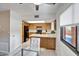 Compact kitchen with black appliances and breakfast nook at 12212 N Paradise Village Pkwy # 308, Phoenix, AZ 85032
