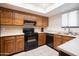 Classic kitchen with natural wood cabinetry and bright countertops at 12212 N Paradise Village Pkwy # 308, Phoenix, AZ 85032