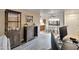 Open living space with gray wood flooring, wine rack cabinet, view of dining table, kitchen and sliding doors at 12212 N Paradise Village Pkwy # 308, Phoenix, AZ 85032