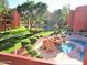 Aerial view of the community pool, landscaping, and well-maintained grounds at 12212 N Paradise Village Pkwy # 308, Phoenix, AZ 85032