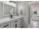 Bright bathroom features a white vanity with black hardware and a stylish mirror at 12755 N 99Th Pl, Scottsdale, AZ 85260