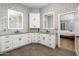 Spacious bathroom featuring double sinks, granite countertops, and white cabinets at 12755 N 99Th Pl, Scottsdale, AZ 85260
