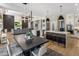 Open-concept kitchen with island seating, dining area, and living room at 12755 N 99Th Pl, Scottsdale, AZ 85260