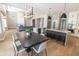 Open floorplan featuring a kitchen with an island, stainless steel appliances and a dining area with fireplace at 12755 N 99Th Pl, Scottsdale, AZ 85260