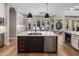 Stunning kitchen island, stainless appliances, and hardwood floors for a luxurious cooking experience at 12755 N 99Th Pl, Scottsdale, AZ 85260