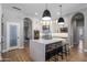 Modern kitchen with quartz countertop island, stainless steel appliances, and a pantry at 12755 N 99Th Pl, Scottsdale, AZ 85260