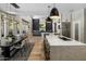 Open-concept living space featuring a kitchen, dining area, and living room at 12755 N 99Th Pl, Scottsdale, AZ 85260
