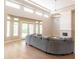 Spacious living room with vaulted ceilings, large windows, fireplace, and hardwood floors at 12755 N 99Th Pl, Scottsdale, AZ 85260