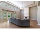 Bright living room featuring hardwood floors, high ceilings, statement lighting, and a cozy fireplace at 12755 N 99Th Pl, Scottsdale, AZ 85260