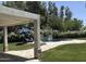 Inviting backyard pool area featuring a covered patio, beautiful landscaping, and comfortable lounge chairs at 12755 N 99Th Pl, Scottsdale, AZ 85260