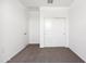 Clean bedroom featuring a closet with sliding doors and neutral carpet at 1345 S Vista Ave, Florence, AZ 85132