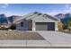 Charming single-story home featuring a xeriscaped yard and a convenient two-car garage at 1345 S Vista Ave, Florence, AZ 85132