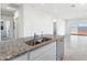 Kitchen island with a double sink and stainless steel dishwasher at 1345 S Vista Ave, Florence, AZ 85132