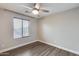 Bedroom with a ceiling fan and a view from the window at 14333 W Lexington Ave, Goodyear, AZ 85395