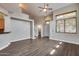 Spacious living room with hardwood floors, neutral paint, and a staircase to the upper level at 14333 W Lexington Ave, Goodyear, AZ 85395