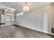 Bright, airy living room featuring hardwood floors, recessed lights and vaulted ceilings at 14333 W Lexington Ave, Goodyear, AZ 85395