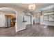 Open-concept layout shows the kitchen with stainless steel appliances next to the spacious living area at 14333 W Lexington Ave, Goodyear, AZ 85395