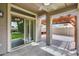 Covered patio with brick flooring, ceiling fan, and views of the backyard and wooden pergola at 14333 W Lexington Ave, Goodyear, AZ 85395