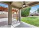 Covered patio and landscaped yard perfect for outdoor entertaining and relaxation at 14333 W Lexington Ave, Goodyear, AZ 85395