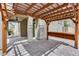 Backyard with brick patio, pergola, bar seating, and covered outdoor kitchen area at 14333 W Lexington Ave, Goodyear, AZ 85395