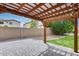 Charming backyard with a pergola over a brick patio with ample seating at 14333 W Lexington Ave, Goodyear, AZ 85395
