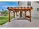 Inviting backyard pergola with seating area on a brick patio perfect for outdoor gatherings at 14333 W Lexington Ave, Goodyear, AZ 85395