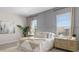 Inviting bedroom with paneling, two large windows, and coordinating nightstands at 15362 W Cottontail Ln, Surprise, AZ 85387