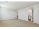 Bright, carpeted bedroom with an ensuite bathroom, featuring light and airy colors at 15362 W Cottontail Ln, Surprise, AZ 85387