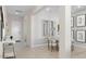 Bright dining room featuring a modern table setting and stylish wall decor at 15362 W Cottontail Ln, Surprise, AZ 85387