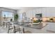 Bright kitchen features a large island, modern appliances, and an adjacent dining area at 15362 W Cottontail Ln, Surprise, AZ 85387