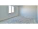 Bedroom featuring a neutral color palette, window and carpet flooring at 15748 W Beryl Ave, Waddell, AZ 85355