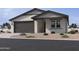 A charming single-story home with a two-car garage and drought resistant landscaping at 15748 W Beryl Ave, Waddell, AZ 85355