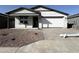 Charming single-story home featuring drought resistant landscaping and a two-car garage at 15748 W Beryl Ave, Waddell, AZ 85355