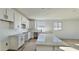 Bright kitchen featuring white cabinetry, stone countertops and a large island at 15748 W Beryl Ave, Waddell, AZ 85355